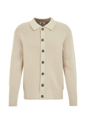 Beige gestrickte Strickjacke aus strukturiertem Stoff, mit Knopfverschluss vorne und dunklen Knöpfen. Mit kragenförmigem Ausschnitt und gerippten Bündchen.