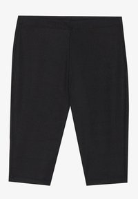 Leggings noirs à côtelés avec une texture lisse, présentant une coupe au genou et une taille élastique pour le confort et un bon ajustement.