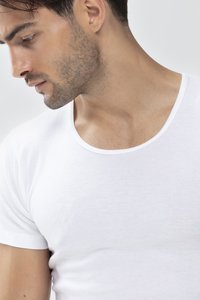 White crew-neck t-shirt made of soft fabric, featuring short sleeves and a smooth texture. Close-up view highlights neckline detail.