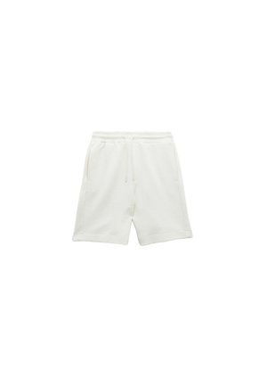 Witte, pluche stoffen shorts met een elastische tailleband, trekkoord, twee zijzakken en een relaxte pasvorm. Geschikt met een gladde textuur zonder patronen.