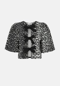 Giacca cropped a manica corta in stampa leopardata con fiocchi neri e un'apertura a forma di chiave davanti. Presenta un tessuto testurizzato con maniche a sbuffo.