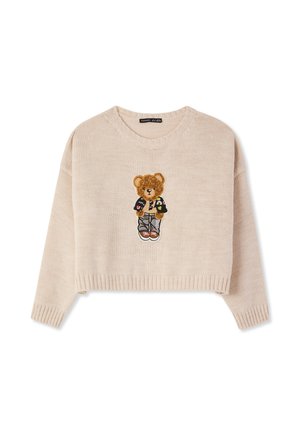 Maglione cropped lavorato a maglia beige con una grafica di orso teddy e dettagli ricamati. Le maniche a costine e l'orlo aggiungono texture.