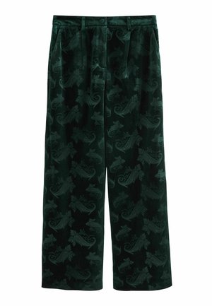 Velvet wide-leg pants in dark green featuring an intricate leaf and paisley pattern. Smooth texture with a button closure and side pockets.