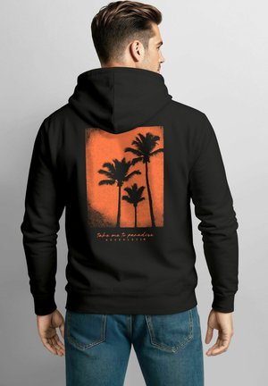 Black hoodie with a textured orange graphic of palm trees and the text "Take me to paradise" printed on the back. Classic fit, cotton blend.