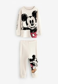 Un ensemble de pyjama pour enfants en deux pièces en tissu doux couleur crème. Le haut présente un grand motif de Mickey Mouse ; le pantalon arbore un plus petit motif de Mickey sur le côté.