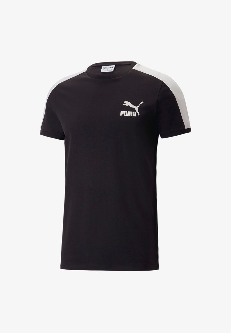 Černé tričko s krátkým rukávem vyrobené z bavlny. Obsahuje bílé pruhy na ramenou a bílé logo Puma na levé straně hrudi. Klasický kulatý výstřih.