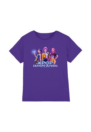 Purple t-shirt featuring three animated female characters posing confidently above the text "K-POP DEMON HUNTERS."