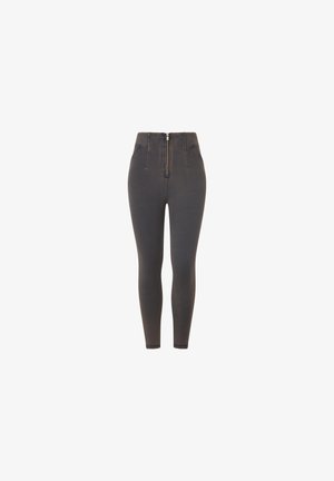 Leggings de mezclilla gris oscuro de cintura alta con cremallera frontal y dos bolsillos laterales. Textura suave, ajuste slim y piernas estrechas.
