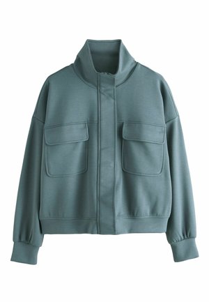 Cropped jacket in muted teal, made of soft fabric. Features a high collar, two front pockets, and ribbed cuffs. Smooth texture throughout.