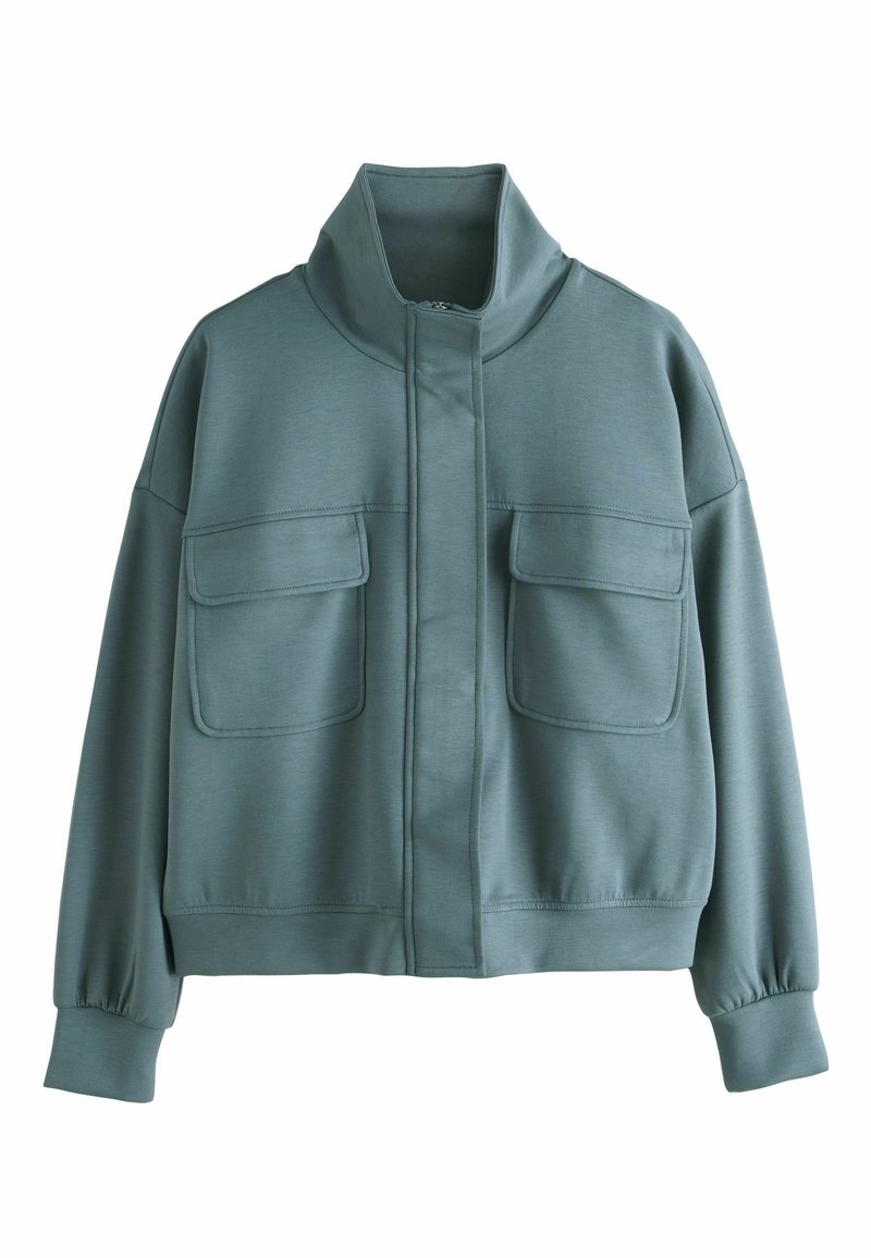 Cropped jacket in muted teal, made of soft fabric. Features a high collar, two front pockets, and ribbed cuffs. Smooth texture throughout.