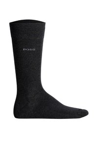 Calze nere a coste realizzate in un tessuto con una superficie liscia. Presentano un logo con marchio, "BOSS," integrato in modo discreto nel design.