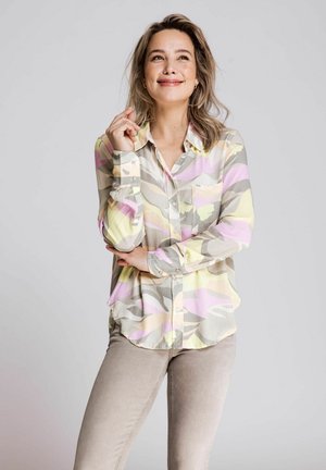 Lightweight blouse in pastel colors with leaf patterns, featuring a button front, long sleeves, and a single chest pocket.