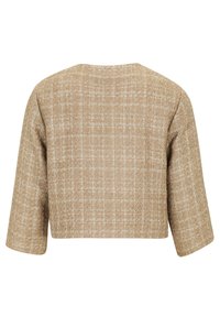 Veste beige courte en tissu texturé, au design simple, avec des manches trois-quarts et un léger motif à carreaux.