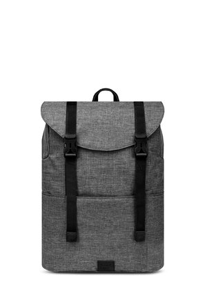 Gray fabric backpack with a flap top, two adjustable black straps, front pocket, and a textured surface. Features a branded logo on the bottom.