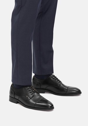 - Biznesowe buty sznurowane