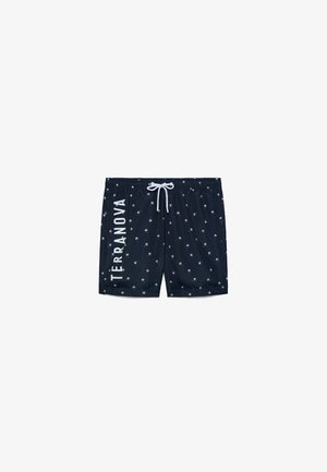 Pantaloncini da bagno blu navy con piccolo motivo di palme bianche, vita con coulisse bianca e scritta "TERRANOVA" in verticale sulla gamba sinistra.