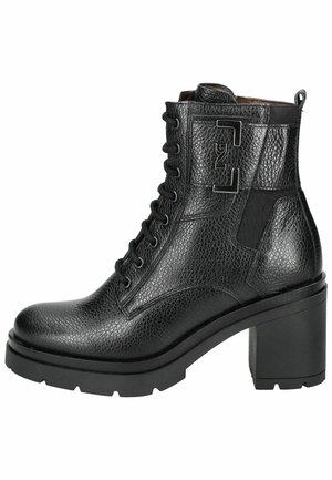Black leather ankle boot with a textured finish, round toe, thick heel, lace-up design, and side elastic panel for flexibility.