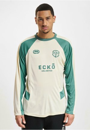Langermet kremfarget jersey med grønne detaljer, med rund hals, sidelapper og "ECKŌ UNLIMITED" logoen i midten.