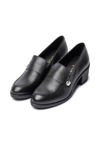 Black leather loafers with a smooth texture, rounded toe, and a low block heel. Features a decorative strap and circular metal accent.