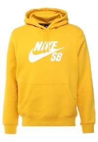 Gul hoodie med framficka och vit Nike SB-logotyp tryckt över bröstet, med en huva som har snörning.