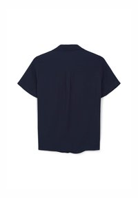 Blouse marine à manches courtes avec un col, comportant un pli au dos et un ourlet droit. Fabriquée dans un tissu lisse et léger.