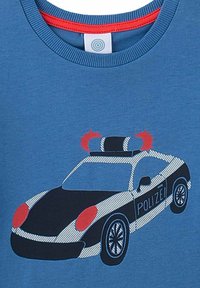 Blue cotton t-shirt featuring a graphic of a police car in black and white with red accents and a blue light bar on top.