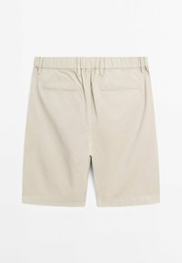 Beige shorts med elastisk talje, to baglommer og en glat stofstruktur. Designet er enkelt og skræddersyet.