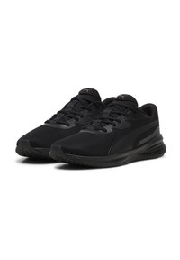 Zapatillas deportivas negras con parte superior de malla, diseño de cordones, superficie texturizada y suela de goma para agarre. Marca minimalista en la lengüeta.