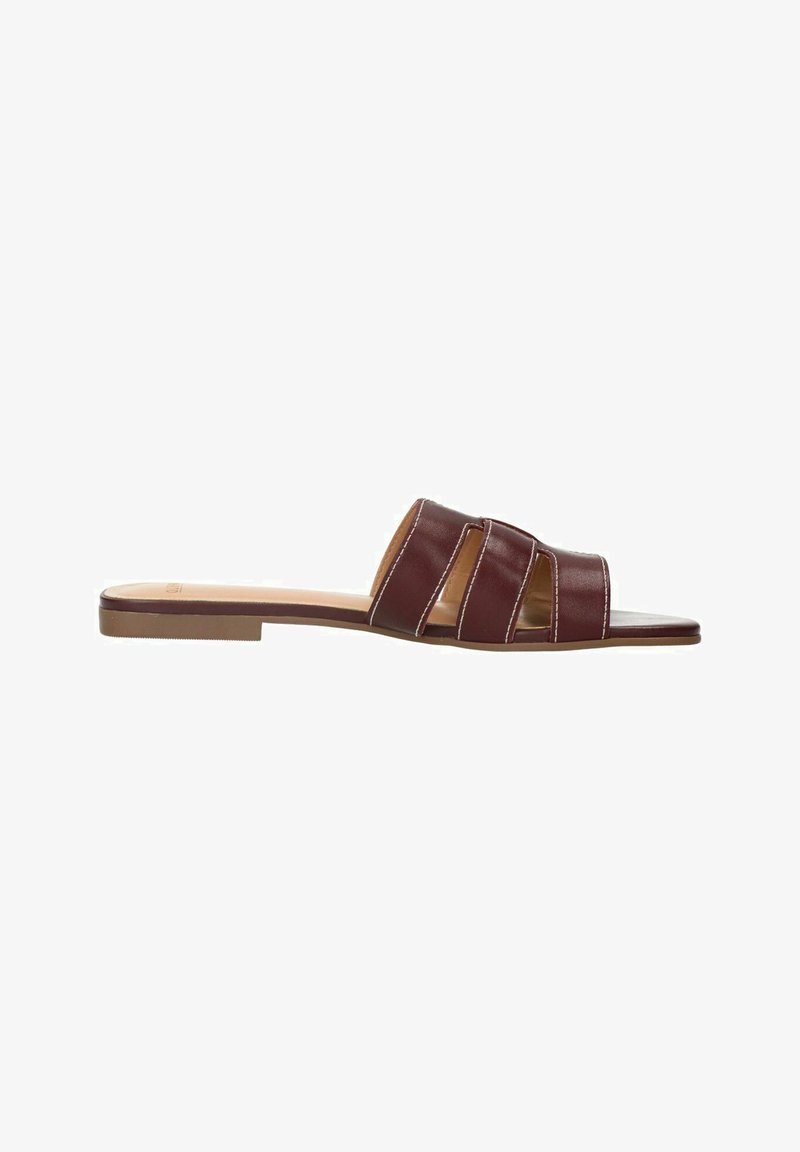 Burgundy slide sandal with three overlapping straps, flat sole, and light stitching details. Made from synthetic material. Smooth texture.