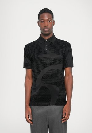 Black polo shirt featuring a textured pattern of the "Emporio Armani" logo, with a classic collar and short sleeves.
