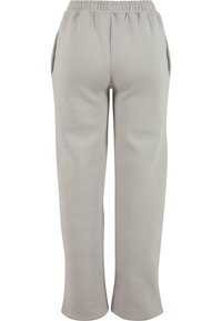 Light gray sweatpants with an elastic waistband, side pockets, and a straight leg design, made from soft, textured fabric.