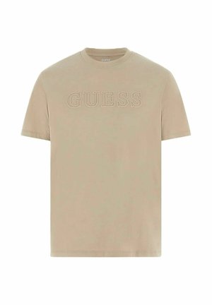 T-shirt beige a maniche corte con scollo tondo e logo "GUESS" in rilievo al centro del petto.
