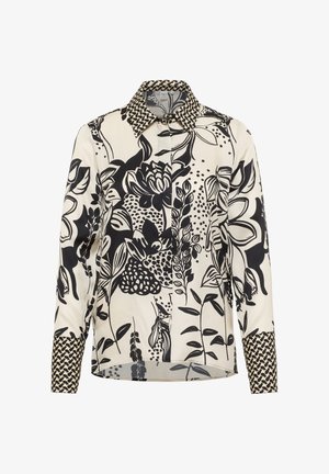 Langärmlige Bluse mit schwarz-beigen Blumen- und Blattmustern, ausgestattet mit einem kontrastierenden geometrischen Druckkragen und -manschetten.