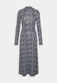 Svart klänning med långa ärmar, hög krage och en figurnära silhuett. Har ett mönster av vita och ljusblå prickar över hela.