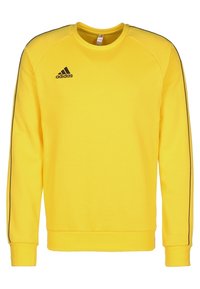 Geel sweatshirt met een ronde hals, lange mouwen, zwarte zijstrepen en een geborduurd zwart Adidas-logo op de linkerkant van de borst.