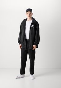 Calvin Klein Jeans CROPPED - Pantaloni - black