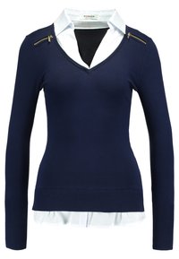 Navy sweater with long sleeves and V-neck, featuring a white collar and zip accents on the shoulder. Soft knit material, fitted design.