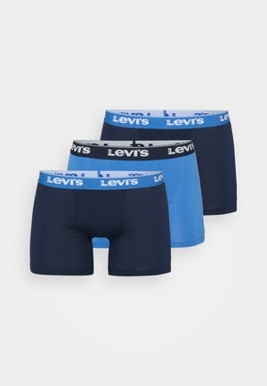 Tres pares de bóxers Levi's: uno azul claro, dos azul marino oscuro con cinturas blancas que presentan el logo de Levi's. Tejido suave y elástico.