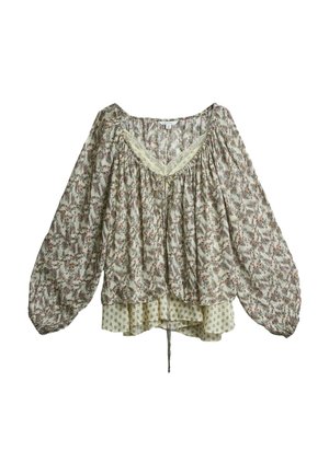 Przezroczysta, kwiatowa bluzka z długim rękawem, dekoltem w kształcie litery V wykończonym koronką, luźnym krojem oraz warstwowym dołem z mniejszym wzorem tkaniny pod spodem.