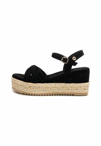 Sandali wedge neri in suede con dettagli intrecciati e cinturino alla caviglia, dotati di una piattaforma avvolta in juta e suola in gomma textured.