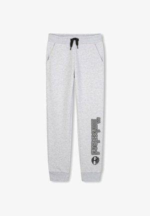 Grijze joggingbroek met een trekkoord in de taille, zijzakken en zwart "Timberland" logo gedrukt langs het linkerbeen. Zachte textuur, taps toelopende pasvorm.