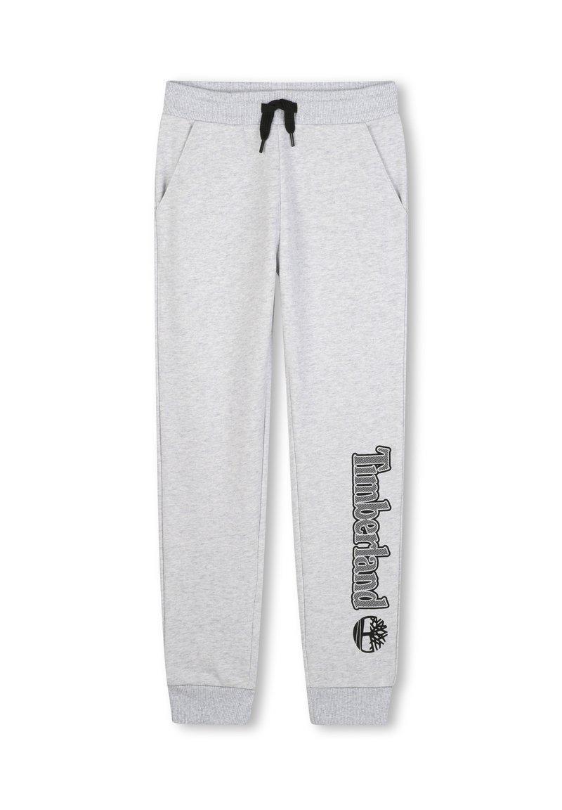 Grijze joggingbroek met een trekkoord in de taille, zijzakken en zwart "Timberland" logo gedrukt langs het linkerbeen. Zachte textuur, taps toelopende pasvorm.