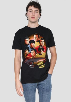 Black cotton t-shirt featuring a colorful print of Star Trek characters and the USS Enterprise, with a graphic orange and yellow background.