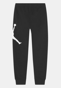 Schwarze Jogginghose mit elastischem Bund, schmal zulaufenden Beinen und einem großen weißen Jumpman-Logo, das an der linken Seite aufgedruckt ist. Weicher Stoff.