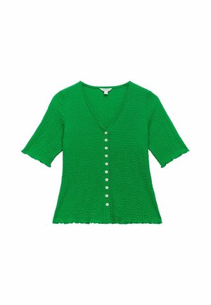Groene top met korte mouwen, een V-hals, met een textuurstof en zeven knopen aan de voorkant. Gepofte randen op de mouwen en de zoom.