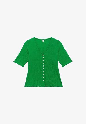 Haut vert à manches courtes avec un col en V, en tissu texturé, et sept boutons sur le devant. Bords froncés sur les manches et l'ourlet.
