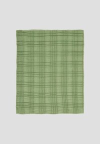 Textile à carreaux verts avec une texture douce et un motif en grille, présentant un subtil design tissé. Le bord est fini par un ourlet soigné.