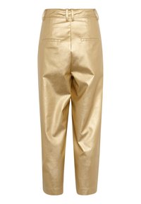 Gold, faux leather trousers with a smooth texture, high waist, and two back pockets. Features belt loops and a tapered ankle cut.