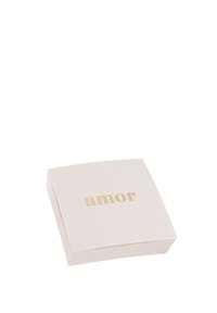 Caja cuadrada de color rosa claro con una superficie lisa y texto dorado que dice "amor". El diseño presenta bordes redondeados. Apariencia sencilla y elegante.