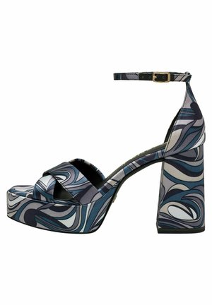 Platform heel sandal in patterned fabric with shades of blue and gray, featuring a thick block heel and ankle strap with gold buckle.